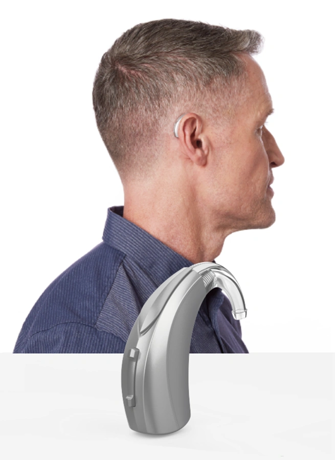 Side profile of a man wearing Behind-the-Ear (BTE) Hearing Aids, discreet hearing aids
