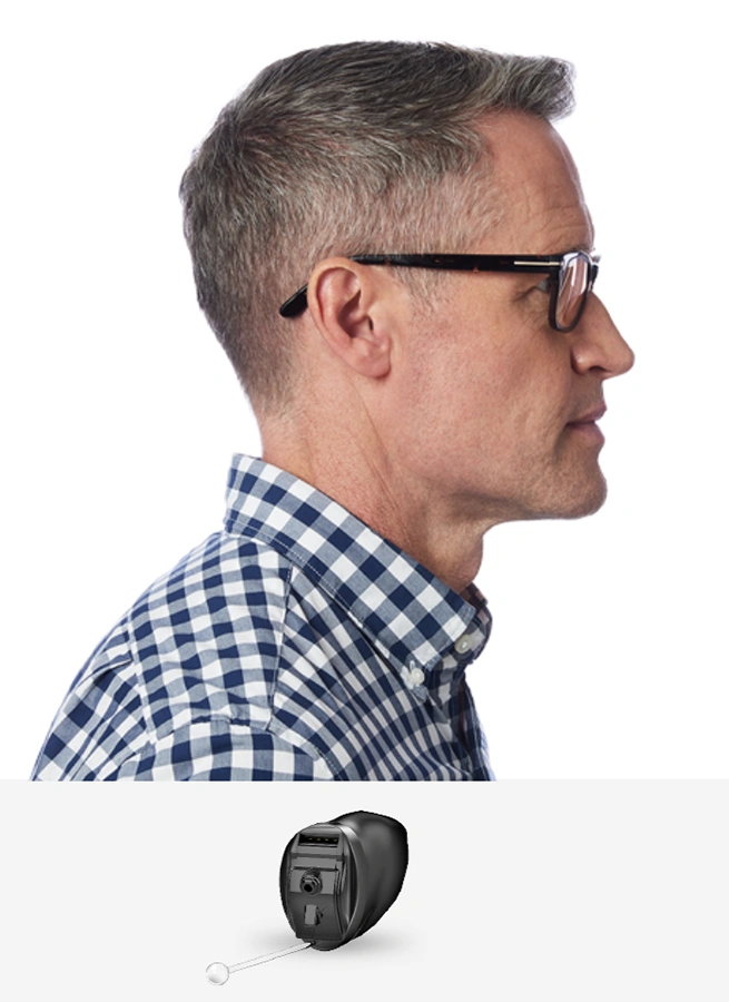 Side profile of a man wearing Invisible-in-Canal (IIC) Hearing Aids, invisible hearing aids